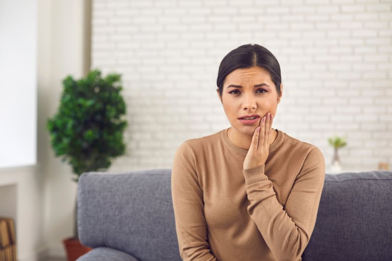 Patient wincing after home teeth whitening