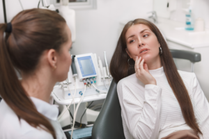 a patient visiting their emergency dentist